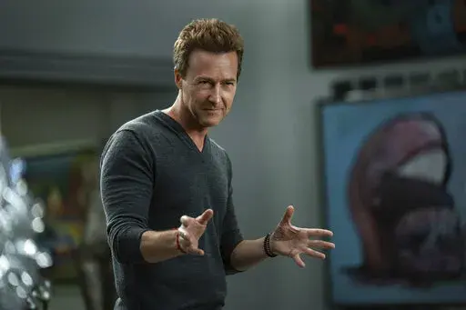 This image released by Netflix shows Edward Norton in a scene from "Glass Onion: A Knives Out Mystery." Norton portrays Miles Bron, an eccentric tech billionaire who brings his wealthy friends to a private island in Greece to take part in a game to solve his murder. (John Wilson/Netflix via AP)