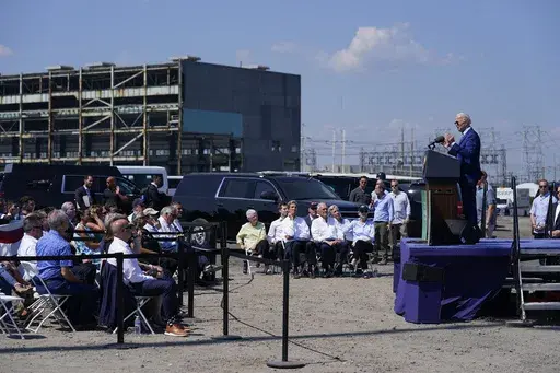 President Joe Biden speaks about climate change and clean energy at Brayton Power Station, July 20, 2022, in Somerset, Mass. The Biden administration is making $450 million available for solar farms and other clean energy projects across the country at the site of current or former coal mines. (AP Photo/Evan Vucci)