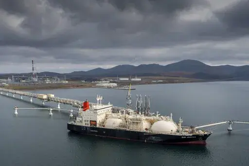 The tanker Sun Arrows loads its cargo of liquefied natural gas from the Sakhalin-2 project in the port of Prigorodnoye, Russia, on Oct. 29, 2021. For the U.S. at least, removing Russia's most favored nation status is a mostly symbolic gesture. The U.S. ban that was announced last month on imports of Russian oil, gas and coal already eliminated about 60% of all U.S. imports from Russia.  (AP Photo/File)