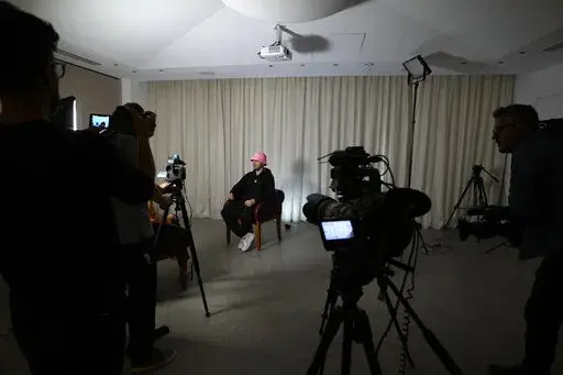 Oleh Psiuk, frontman of Ukraine's Kalush Orchestra talks during an interview in Turin, Italy, Thursday May 5, 2022. Ukrainian band Kalush Orchestra’s upbeat, melodic entry to this month’s Eurovision Song Contest was written as a tribute to the frontman’s mother. But since the Russian invasion of Ukraine, the song called “Stefania” has become an anthem to the country's war-ravaged motherland.  (AP Photo/Antonio Calanni)