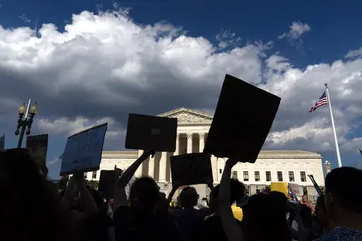 Abortion-rights activists protest outside the Supreme Court in Washington, Saturday, June 25, 2022. The Supreme Court has ended constitutional protections for abortion that had been in place nearly 50 years, a decision by its conservative majority to overturn the court's landmark abortion cases. (AP Photo/Jose Luis Magana)