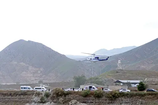 The helicopter carrying Iranian President Ebrahim Raisi takes off at the Iranian border with Azerbaijan after President Raisi and his Azeri counterpart Ilham Aliyev inaugurated dam of Qiz Qalasi, or Castel of Girl in Azeri, Iran, on May 19, 2024. While the cause of the May 19 crash remains unknown, the sudden death of the hard-line protégé of Iranian Supreme Leader Ayatollah Ali Khamenei exposed the contradictions and challenges facing the country's Shiite theocracy. (Ali Hamed Haghdoust, IRNA