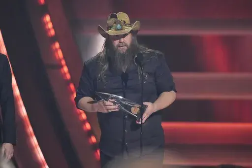 Chris Stapleton accepts the award for single of the year for "White Horse" during the 58th Annual CMA Awards on Wednesday, Nov. 20, 2024, at Bridgestone Arena in Nashville, Tenn. (AP Photo/George Walker IV)