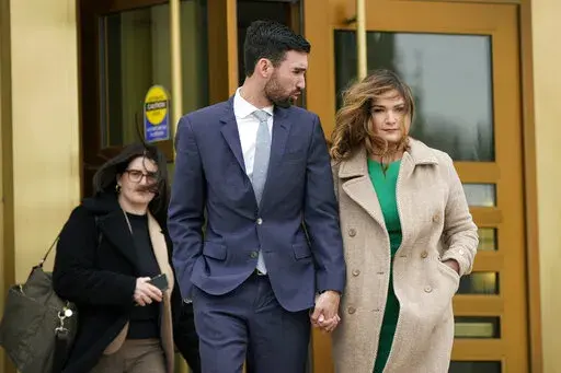 Democrat Abby Finkenauer leaves the Iowa Supreme Court Building with her husband Daniel Wasta, Wednesday, April 13, 2022, in Des Moines, Iowa. The Iowa Supreme Court has ruled that  Finkenauer qualifies for the primary ballot, rejecting a lower court decision and allowing her to continue her campaign for the nomination. The court’s decision Friday, April 15, leaves Finkenauer as the likely front-runner in a race with two lesser-known candidates ahead of Iowa’s June 7 primary.  (AP Photo/Char