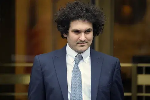 FTX founder Sam Bankman-Fried leaves Manhattan federal court in New York, Feb. 16, 2023. Bankman-Fried sought a dismissal of criminal charges against him in a court filing late Monday, May 8, saying prosecutors have improperly made federal crimes out of civil and regulatory issues that resulted from an industrywide collapse of cryptocurrency markets. (AP Photo/John Minchillo, File)