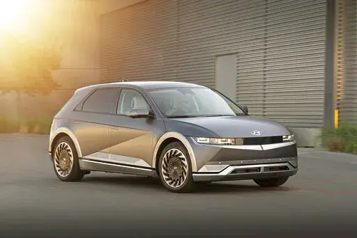 This photo provided by Hyundai shows the 2022 Hyundai Ioniq 5, a small electric SUV with retro-inspired looks and up to 303 miles of EPA-estimated range. (David Dewhurst/Courtesy of Hyundai Motor America via AP)