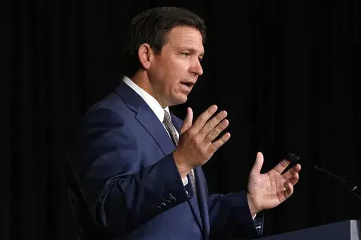 Florida Gov. Ron DeSantis speaks, Feb. 15, 2023, at Palm Beach Atlantic University in West Palm Beach, Fla. Gov. DeSantis has signed a bill to give himself control of Walt Disney World’s self-governing district, punishing the company over its opposition to the so-called “Don’t Say Gay” law. The bill requires DeSantis, a Republican, to appoint a five-member board to oversee the government services that the Disney district provides in its sprawling theme park properties in Florida. The gov