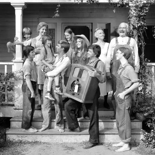 This 1974 photo provided by CBS shows, from left, David Harper, as Jim-Bob Walton; Eric Scott, as Ben Walton; Michael Learned, as Olivia Walton; Kami Cotler, as Elizabeth Walton; Richard Thomas, as John Boy Walton; Mary McDonough, as Erin Walton; Judy Norton, as Mary Ellen Walton; Ralph Waite, as John Walton; Ellen Corby, as Ester “Grandma” Walton; Will Geer, as Zeb “Grandpa” Walton; Jon Walmsley, as Jason Walton, in the television show The Waltons. (CBS Photo Archive via AP)