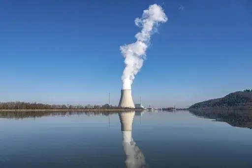 Water vapor rises from the nuclear power plant Isar II in Essenbach, Germany, March 3, 2022. Germany is shutting down this nuclear power plant and two others on Saturday, April, 2023, as part of an energy transition agreed by successive governments. (Armin Weigel/dpa via AP, File)
