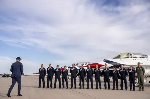 President Joe Biden greats a group of Thunderbird pilots after arriving at Peterson Space Force Base in Colorado Springs, Colo., Wednesday, May 31, 2023. Biden has decided to keep U.S. Space Command headquarters in Colorado, overturning a last-ditch decision by the Trump administration to move it to Alabama and ending months of politically fueled debate, according to senior U.S. officials. (AP Photo/Andrew Harnik, File)