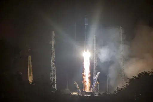 This photo provided by the CNES shows a Russian Soyuz rocket lifting off from the Kourou space base, French Guiana, early Wednesday Dec.18, 2019. The war in Ukraine is causing a swift and broad decaying of scientific ties between Russia and the West. (JM Guillon/ESA-CNES-Arianespace via AP, File)