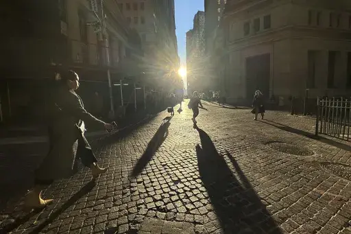 Pedestrians cross Wall Street in New York's Financial District on Nov. 19, 2024. (AP Photo/Peter Morgan, File)