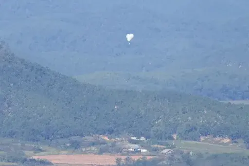 North Korean balloons are seen from the Unification Observation Post in Paju, South Korea, near the border with North Korea, on Oct. 4, 2024. (AP Photo/Lee Jin-man, File)