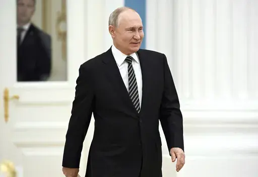 Russian President Vladimir Putin arrives to meet with the leaders of all the main religious denominations of Russia in the Catherine Hall of the Moscow Kremlin in Moscow, Russia, Wednesday, Oct. 25, 2023. (Sergei Guneyev, Sputnik, Kremlin Pool Photo via AP)