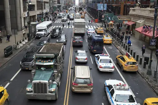 Traffic traverses 42nd Street near Grand Central Terminal, in New York, Jan. 11, 2018. Most drivers would pay $15 to enter Manhattan's central business district under a plan released by New York officials Thursday, Nov. 30, 2023. The congestion pricing plan, which neighboring New Jersey has filed a lawsuit over, will be the first such program in the United States if it receives final approval by transit officials. (AP Photo/Mary Altaffer, File)