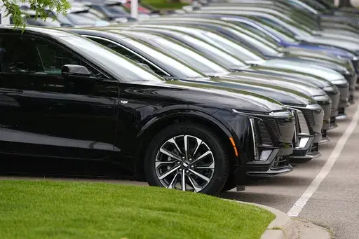 Vehicles sit in a row outside a dealership, June 2, 2024, in Lone Tree, Colo. Car dealerships across North America have faced a major disruption this week. CDK Global, a company that provides software for thousands of auto dealers in the U.S. and Canada, was hit by back-to-back cyberattacks on Wednesday, June 19, 2024. (AP Photo/David Zalubowski, File)