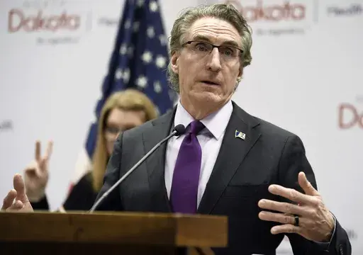 North Dakota Gov. Doug Burgum speaks at the state Capitol on April 10, 2020, in Bismarck, N.D. Burgum on Thursday, March 30, 2023, vetoed a bill that would prohibit public schools teachers and staff from referring to transgender students by pronouns other than those reflecting the sex assigned to them at birth in most cases. (Mike McCleary/The Bismarck Tribune via AP, File)