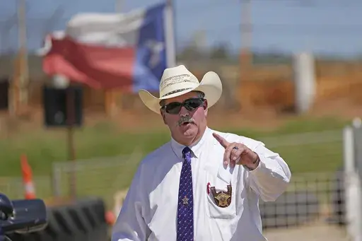 San Jacinto County Sheriff Greg Capers answers a question after a news conference, Sunday, April 30, 2023, in Cleveland, Texas. Capers’ turn in the national spotlight after an April mass shooting belied years of complaints about corruption and dysfunction that were previously unknown outside the piney woods of San Jacinto County. (AP Photo/David J. Phillip, File)