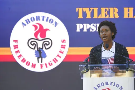 The Mississippi director for Planned Parenthood Southeast, Tyler Harden, tells an audience of reproductive rights supporters that efforts to limit abortion access are "just another form of oppression" for women of color, at a rally in Smith Park Jackson, Miss., on Dec. 1, 2021. (AP Photo/Rogelio V. Solis)