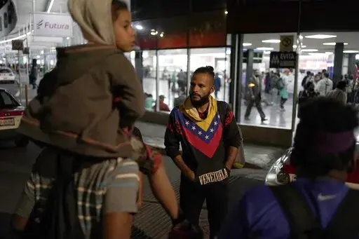 Venezuelan migrants wait for a bus to take them north, at the Northern Bus Station in Mexico City, Oct. 13, 2022. President Joe Biden last week invoked a Trump-era rule known as Title 42, which Biden's own Justice Department is fighting in court, to deny Venezuelans fleeing their crisis-torn country the chance to request asylum at the border. The rule, first invoked by Trump in 2020, uses emergency public health authority to allow the United States to keep migrants from seeking asylum at the bor