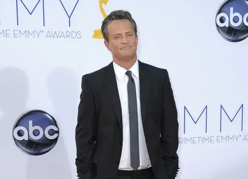 Actor Matthew Perry arrives at the 64th Primetime Emmy Awards in Los Angeles on Sept. 23, 2012. (Photo by Jordan Strauss/Invision/AP, File)