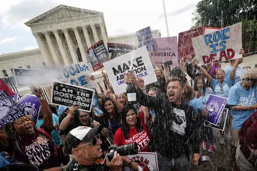 Anti-abortion advocates celebrate outside the Supreme Court in Washington on June 24, 2022, following the court's decision to end constitutional protections for abortion that had been in place nearly 50 years. One year ago, the U.S. Supreme Court rescinded a five-decade-old right to abortion, prompting a seismic shift in debates about politics, values, freedom and fairness. (AP Photo/Steve Helber)