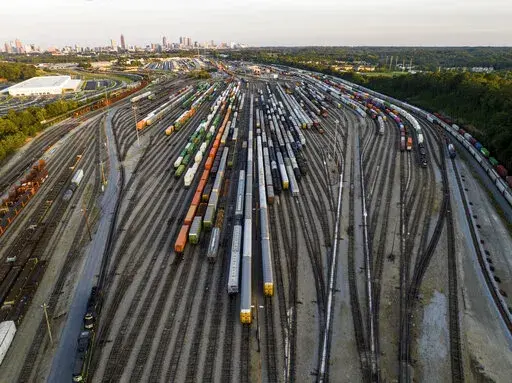 Freight train cars sit in a Norfolk Southern rail yard on Sept. 14, 2022, in Atlanta. Business groups are increasing the pressure on lawmakers to intervene and block a railroad strike before next month's deadline in the stalled contract talks. A coalition of more than 400 business groups sent a letter to Congressional leaders Monday, Nov. 28, 2022 urging them to step in because of fears about the devastating potential impact of a strike that could force many businesses to shut down. (AP Photo/Da