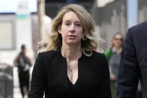 Former Theranos CEO Elizabeth Holmes leaves federal court in San Jose, Calif., March 17, 2023. On Monday, April 10, Holmes was rebuffed in her attempt to stay out of federal prison while she appeals her conviction for the fraud she committed while overseeing a blood-testing scam that exposed Silicon Valley’s dark side. (AP Photo/Jeff Chiu, File)