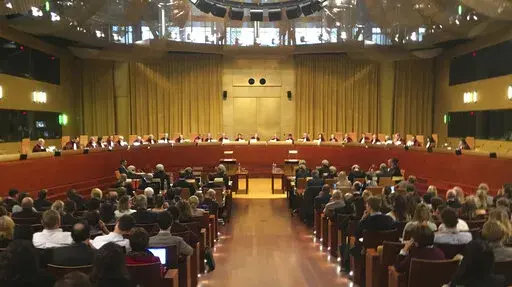 Judges preside over a hearing at the European Court of Justice in Luxembourg on Nov. 27, 2018. The European Union's highest court ruled on Wednesday, Feb. 16, 2022 that the 27-nation bloc can link financial backing for member states to respect for rule of law and that a challenge by Hungary and Poland should be dismissed. (AP Photo/Sylvain Plazy, File)