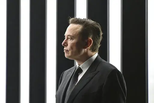 Elon Musk, Tesla CEO, attends the opening of the Tesla factory Berlin Brandenburg in Gruenheide, Germany, March 22, 2022. Elon Musk will be able to include new evidence from a Twitter whistleblower as he fights to get out of his $44 billion deal to buy the social media company, but Musk won’t be able to delay a high-stakes October trial over the dispute, a judge ruled Wednesday, Sept. 7, 2022. (Patrick Pleul/Pool via AP)