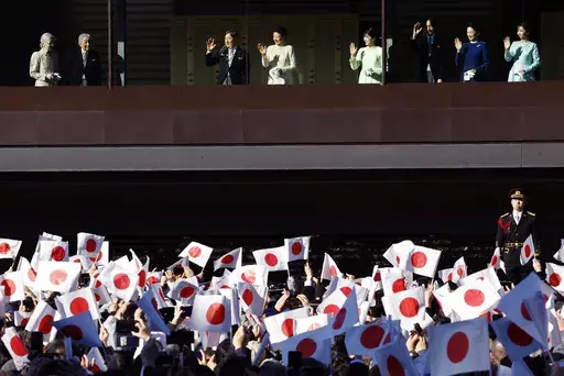 Japan's Empress Emerita Michiko, from left, Emperor Emeritus Akihito, Emperor Naruhito, Empress Masako, Princess Aiko, Crown Prince Akishino, Crown Princess Kiko and Princess Kako wave at well-wishers during a public appearance for New Year celebrations at the Imperial Palace in Tokyo, Thursday, Jan. 2, 2025. (Kim Kyung-Hoon/Pool Photo via AP)