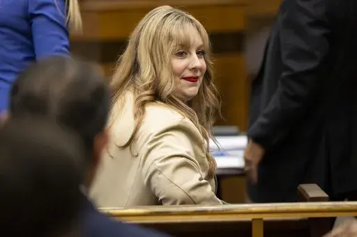 Abby Zwerner, a teacher shot by her 6-year-old student, attends a hearing for a civil lawsuit she filed against the Newport News Public Schools, Friday, Oct. 27, 2023 in Newport News, Va. Zwerner can proceed with her $40 million lawsuit against Newport News Public Schools, a judge ruled Friday, Nov. 3. The school system had argued that Zwerner’s injuries fell under Virginia’s workers compensation law. (Billy Schuerman/The Virginian-Pilot via AP, File)