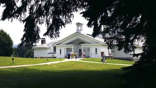 Visitors walk into the Norman Rockwell Museum Friday, July 22, 2005, in Stockbridge, Mass. The museum will present an exhibition, opening on Saturday, May 7, 2022, of works celebrating the 100th anniversary of the Lincoln Memorial. (AP Photo/Chitose Suzuki, File)