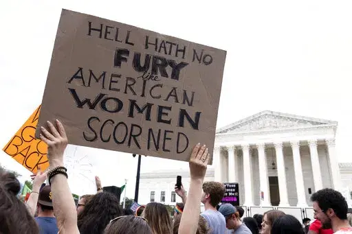 People protest following the Supreme Court's decision to overturn Roe v. Wade in Washington, June 24, 2022. Democrats are pumping an unprecedented amount of money into advertising related to abortion rights, underscoring how central the message is to the party in the final weeks before the November midterm elections. (AP Photo/Jacquelyn Martin, File)