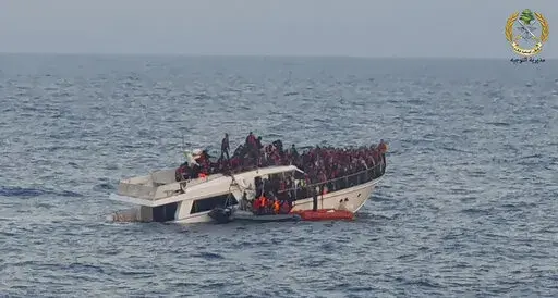 File In this photo released by the Lebanese Army, shows Lebanese army on their dinghy, rescuing migrants from a boat sinking in the Mediterranean Sea, near the shores of Tripoli, north Lebanon, Saturday, Dec. 31, 2022. A short Lebanese army statement said the vessel was carrying people "who were trying to illegally leave Lebanon's territorial waters." It said three Lebanese navy boats and one from the U.N. peacekeeping force in Lebanon, known as UNIFIL, were rescuing the approximately 200 migran