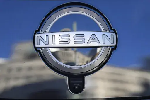 A Nissan logo is seen on a car at its showroom in Tokyo, Feb. 21, 2023. Nissan is recalling more than 809,000 small SUVs in the U.S. and Canada, Tuesday, Feb. 28, because a key problem can cause the ignition to shut off while they’re being driven. The recall covers Rogues from the 2014 through 2020 model years, as well as Rogue Sports from 2017 through 2022. (AP Photo/Shuji Kajiyama, File)