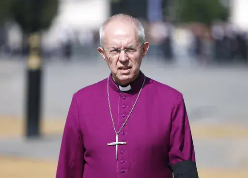 The Archbishop of Canterbury Justin Welby walks in Westminster on Sept. 14, 2022. The Church of England said Wednesday, Jan. 18, 2023, it will allow blessings for same-sex, civil marriages for the first time — but its position on gay marriage will not change and same-sex couples will still not be able to marry in its churches. The plans, to be outlined in a report to the General Synod, which meets in London next month, came after five years of debate and consultation on the church's position o