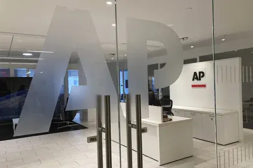 The Associated Press logo is shown at the entrance to the news organization's office in New York on Thursday, July 13, 2023. The Associated Press has issued guidelines for its journalists on use of artificial intelligence, saying the tool cannot be used to create publishable content and images for the news service. (AP Photo/Aaron Jackson, File