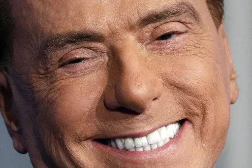 Italian former Premier and Forza Italia (Go Italy) party leader, Silvio Berlusconi, smiles during the recording of the Italian state television RAI, Porta a Porta (Door To Door) TV talk show in Rome Thursday, Jan. 11, 2018. Italy is poised to elect a new president, a figure who is supposed to serve as the nation's moral compass and foster unity by being above the political fray. Silvio Berlusconi thinks he fits the bill. (AP Photo/Andrew Medichini, File)