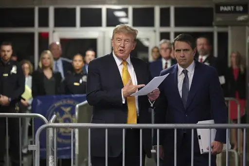 Former President Donald Trump speaks alongside his attorney Todd Blanche following the day's proceedings in his trial Tuesday, May 21, 2024, in Manhattan Criminal Court in New York. (Michael M. Santiago/Pool Photo via AP)