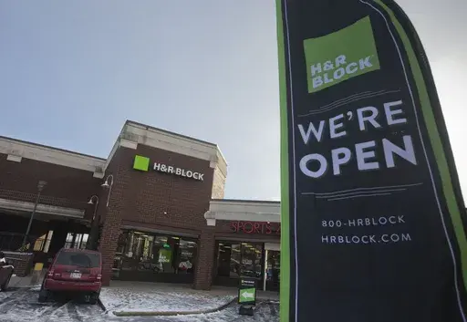 An ad banner appears in the parking lot of the H&R Block offices on Thursday, Jan. 8, 2015, in the Atlas District in Washington. (AP Photo/Pablo Martinez Monsivais, File)