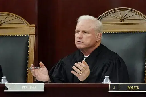 Arizona Supreme Court Chief Justice Robert M. Brutinel speaks during oral arguments, in Phoenix on April 20, 2021. Arizona victims of long-ago child sex abuse can proceed with lawsuits against groups like the Boy Scouts of America following a recent decision by the state Supreme Court that rejected claims that a 2019 state law extending victims' right to sue was unconstitutional. (AP Photo/Matt York, File)