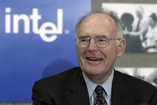 Gordon Moore, the legendary Intel Corp. co-founder who predicted the growth of the semiconductor industry, smiles during a news conference, Thursday, May 24, 2001, in Santa Clara, Calif. Moore, the Intel Corp. co-founder who set the breakneck pace of progress in the digital age with a simple 1965 prediction of how quickly engineers would boost the capacity of computer chips, has died. He was 94. Intel and the Gordon and Betty Moore Foundation say Moore died Friday, March 24, 2023 at his home in 