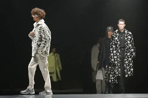 Models wear creations for the Fendi fall winter 22/23 collection, in Milan, Italy, Saturday, Jan. 15, 2022. (AP Photo/Antonio Calanni)