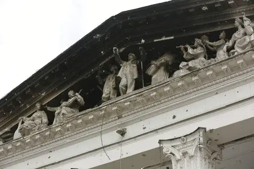 Part of the Donetsk Academic Regional Drama Theatre in Mariupol, Ukraine, is charred following a bombing on March 16, 2022, when the theater was used as a shelter, in an area now controlled by Russian forces Monday, April 4, 2022. The bombing of the theater stands out as the war's single deadliest known attack against civilians to date. (AP Photo/Alexei Alexandrov, File)