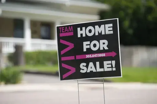 A for sale sign stands outside a single-family residence on Sunday, June 18, 2023, in Denver. On Thursday, Freddie Mac reports on this week's average U.S. mortgage rates. (AP Photo/David Zalubowski)