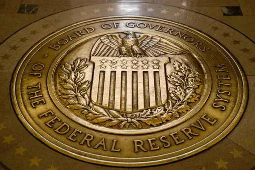 The seal of the Board of Governors of the United States Federal Reserve System is displayed in the ground at the Marriner S. Eccles Federal Reserve Board Building in Washington, Feb. 5, 2018. On Friday, April 14, 2023, The Associated Press reported on stories circulating online incorrectly claiming that a new Federal Reserve digital app, FedNow, will eliminate physical cash. (AP Photo/Andrew Harnik, File)