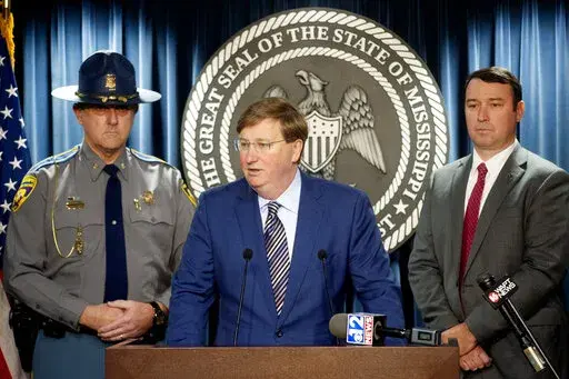 Mississippi Gov. Tate Reeves, center, expresses his gratitude for law enforcement during COVID-19, at a news conference at the Walter Sillers Building in Jackson, Miss., on Monday, Dec. 20, 2021. (Eric Shelton/The Clarion-Ledger via AP)