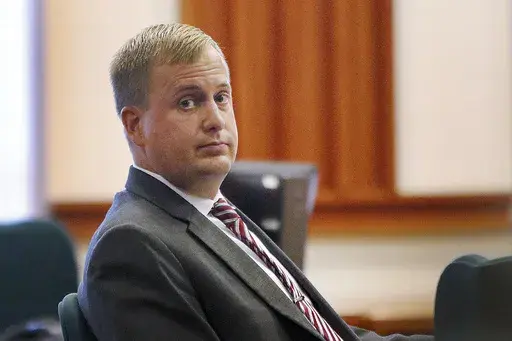 Former Idaho state Rep. Aaron von Ehlinger glances toward the gallery during his rape trial at the Ada County Courthouse on April 27, 2022, in Boise, Idaho. A former legislative intern is suing von Ehlinger who was convicted of raping her and one of his colleagues for releasing her name and launching a harassment campaign. The young woman, who uses the pseudonym "Jane Doe" in the federal lawsuit, was just 19 when she reported that then-Rep. Aaron von Ehlinger raped her at his Boise, Idaho, apart