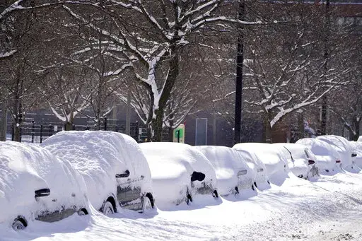 Cars parked for several days Tuesday, Feb. 16, 2021, are covered in cumulative snow in Chicago, the morning after a snowstorm dumped up to 18 inches in the greater Chicago area. Storing a vehicle because it’s not needed is something that an owner might have to do at some point. It might be because it’s a sports car that the owner wants to protect from wintertime driving, or perhaps a vehicle that won’t be driven for months because of a vacation or military deployment. Whatever the reason, 